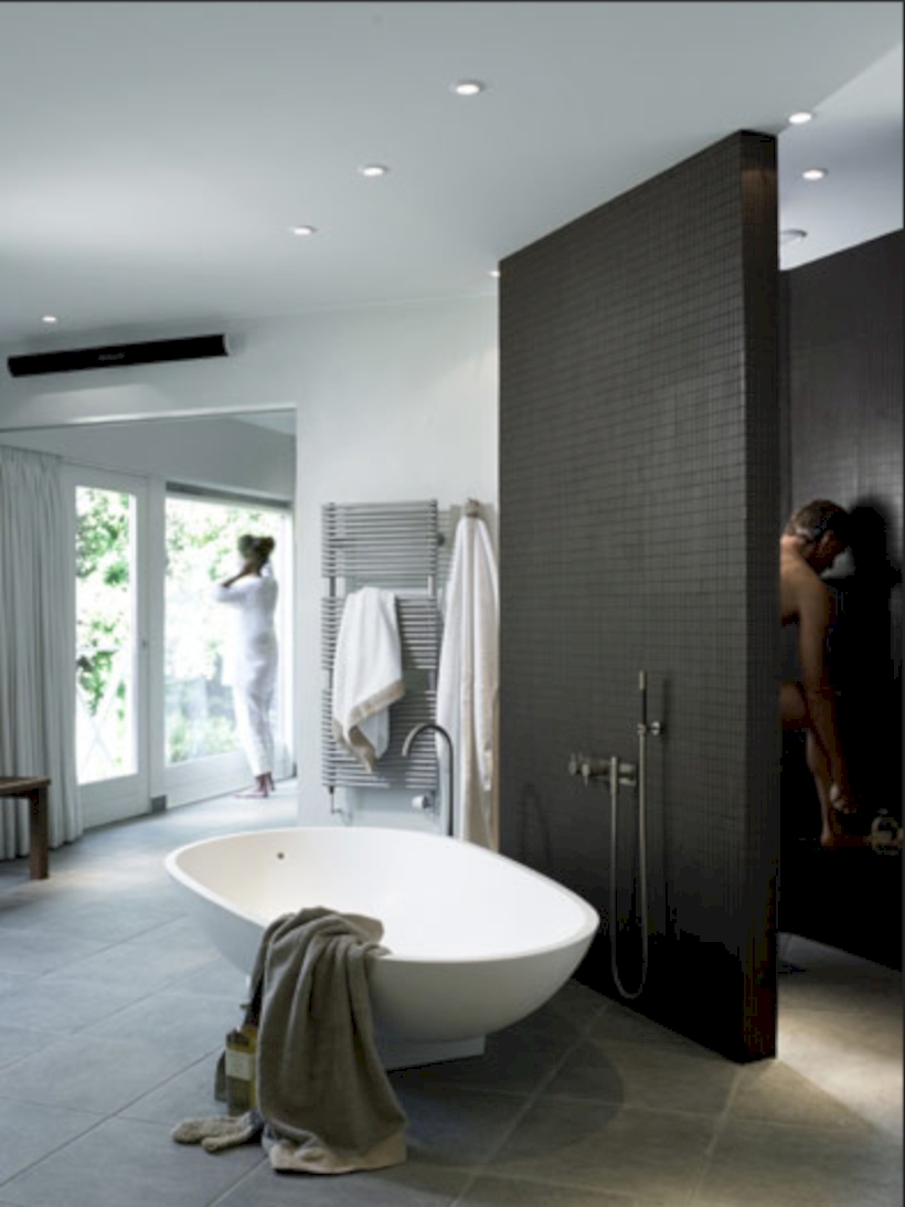 Nice and minimalist bathroom with the glass wall with a concrete 10