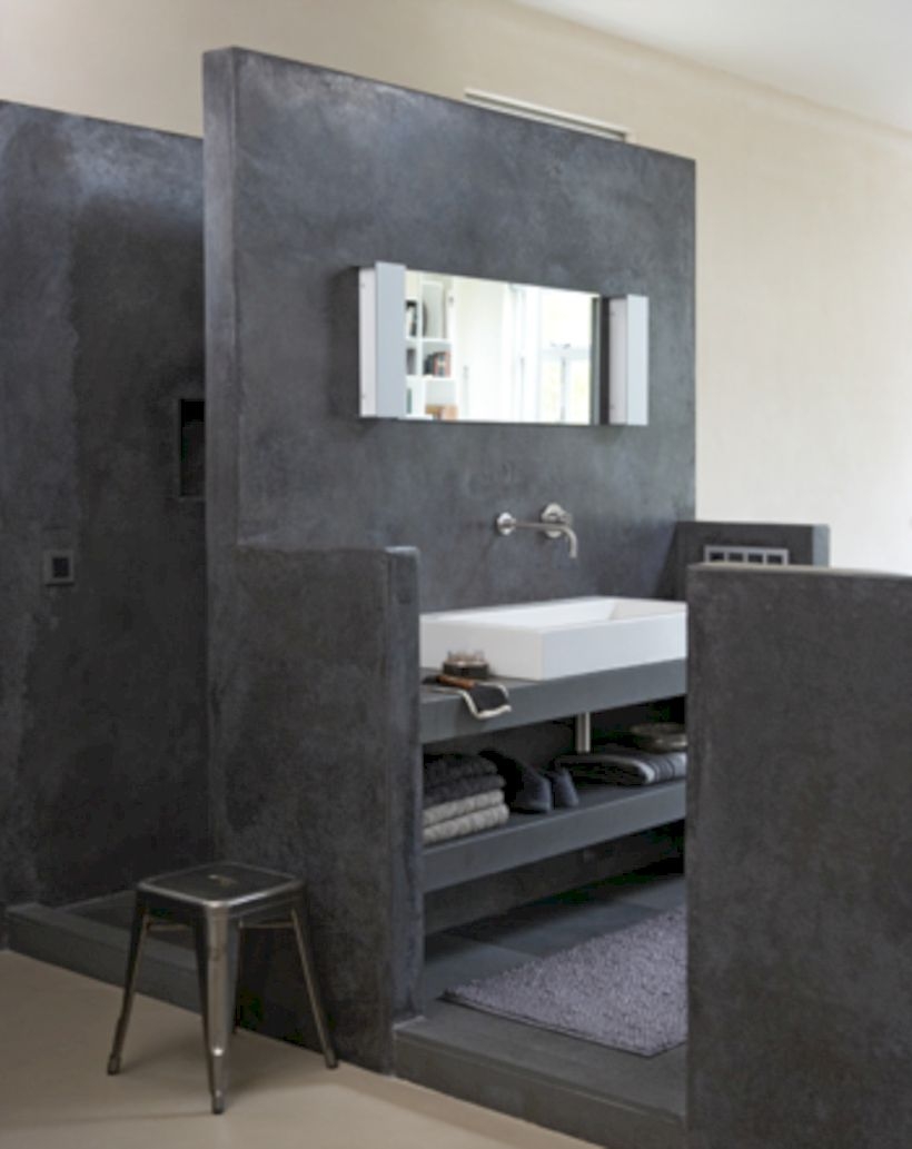 Nice and minimalist bathroom with the glass wall with a concrete 15