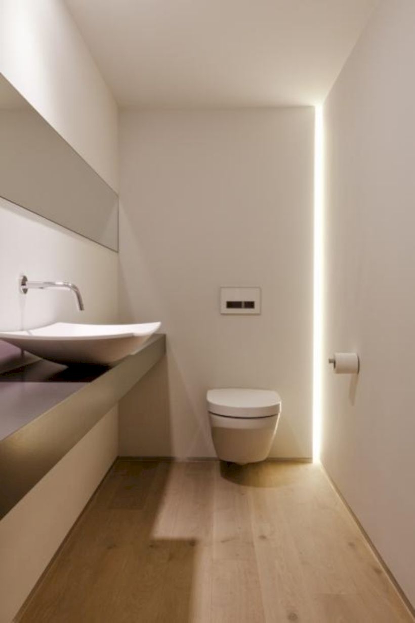 Nice and minimalist bathroom with the glass wall with a concrete 16