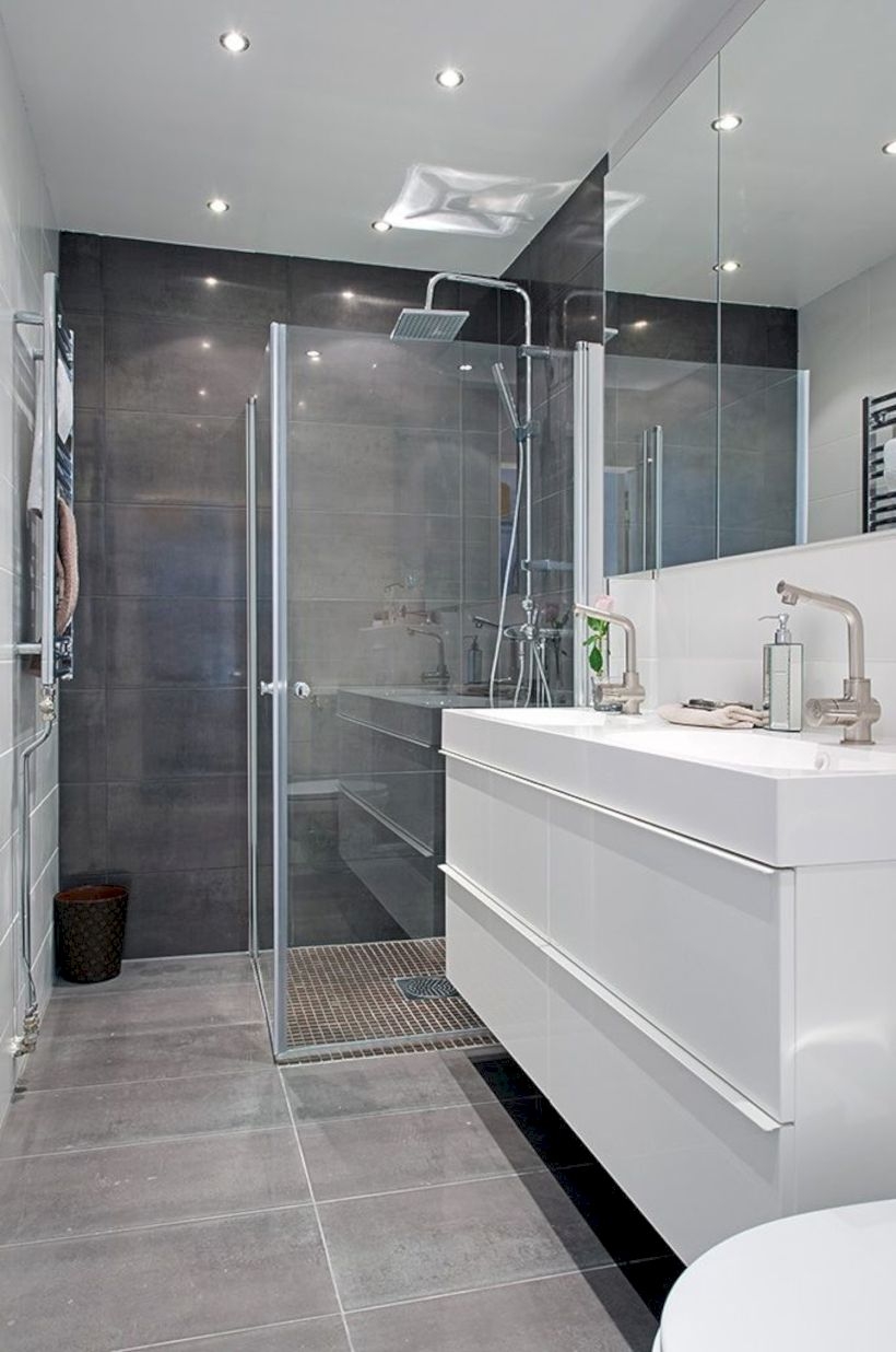 Nice and minimalist bathroom with the glass wall with a concrete 21