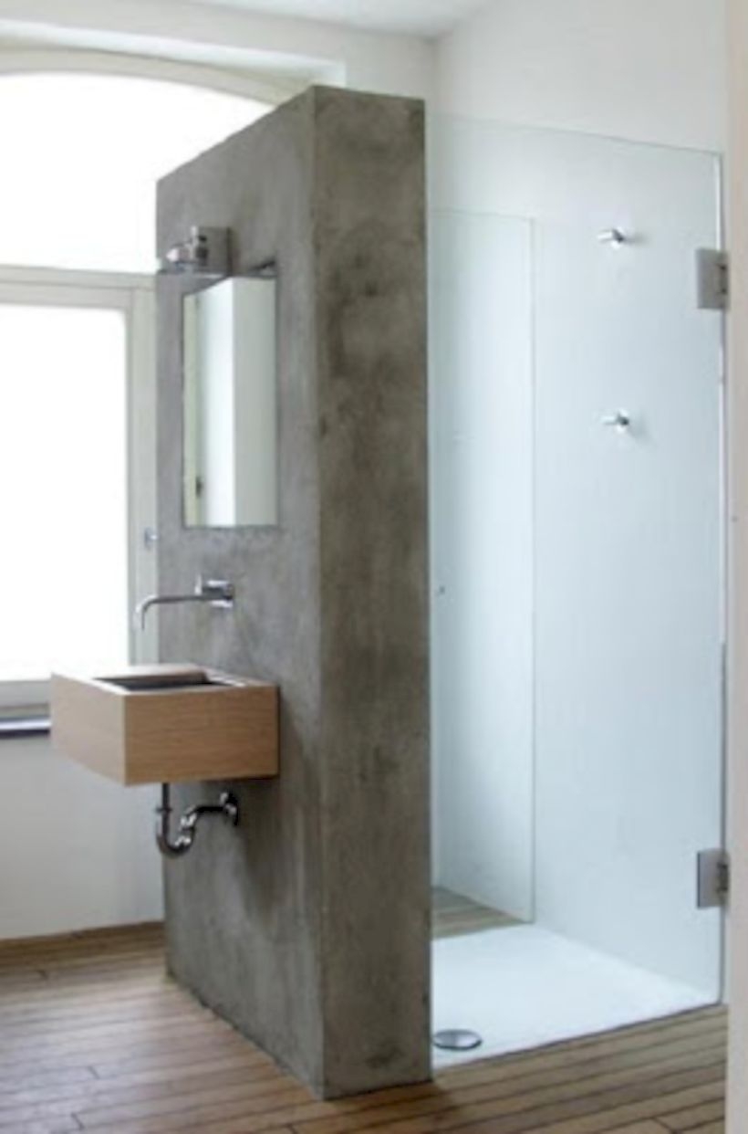 Nice and minimalist bathroom with the glass wall with a concrete 22