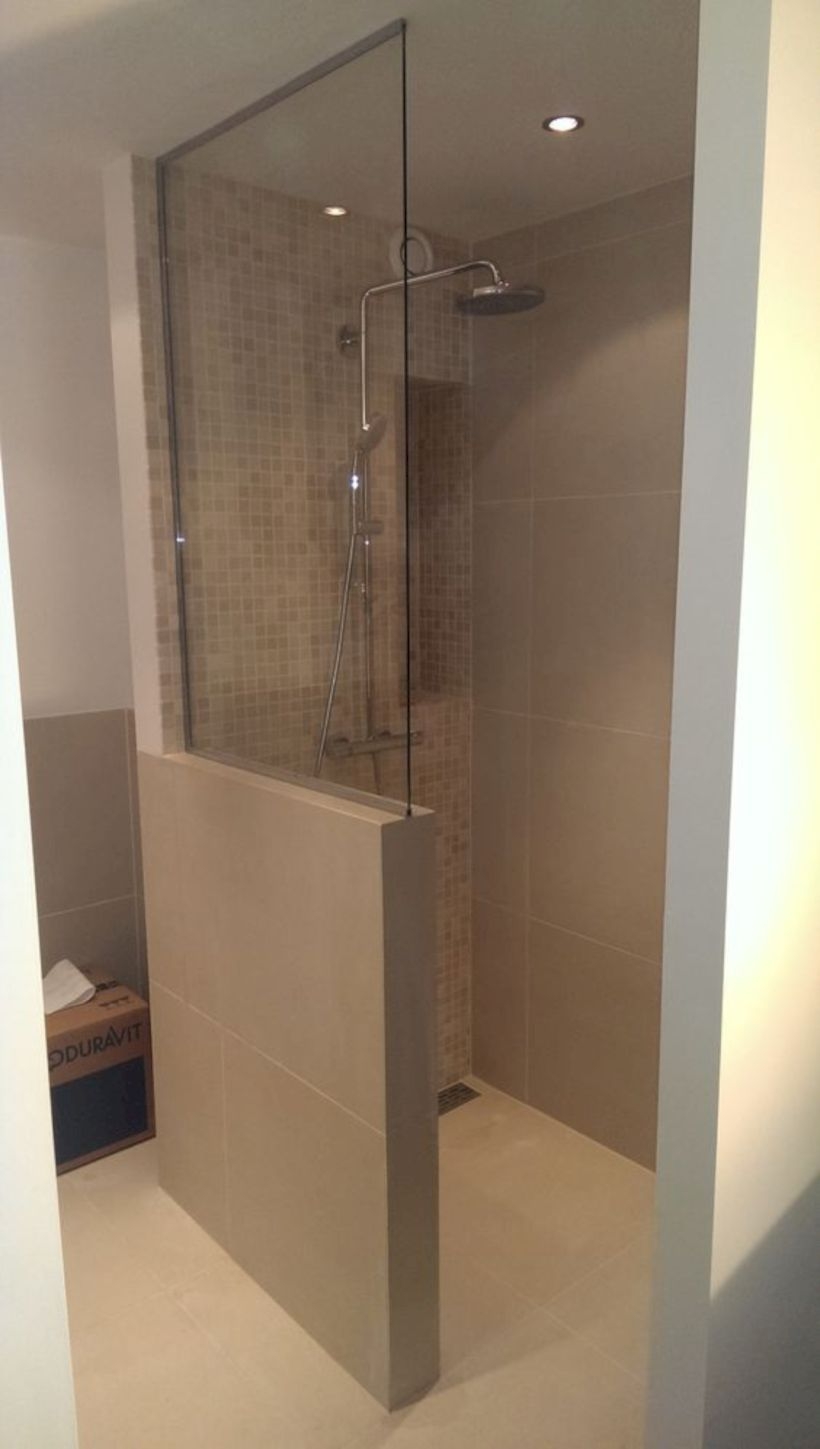 Nice and minimalist bathroom with the glass wall with a concrete 29