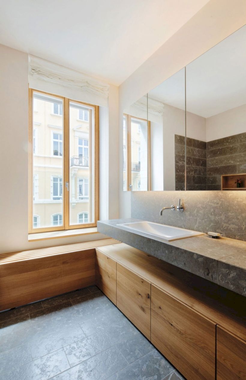 Nice and minimalist bathroom with the glass wall with a concrete 30