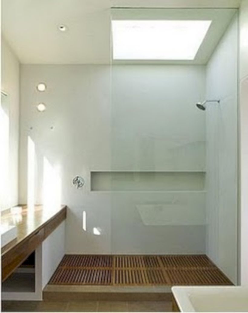 Nice and minimalist bathroom with the glass wall with a concrete 32