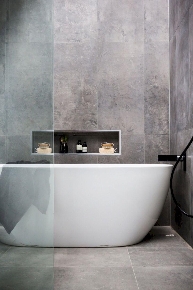 Nice and minimalist bathroom with the glass wall with a concrete 35