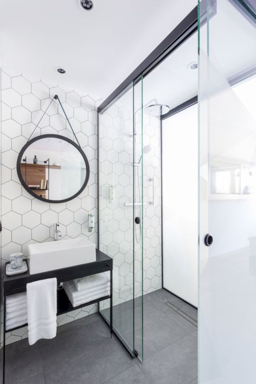 Nice and minimalist bathroom with the glass wall with a concrete 36