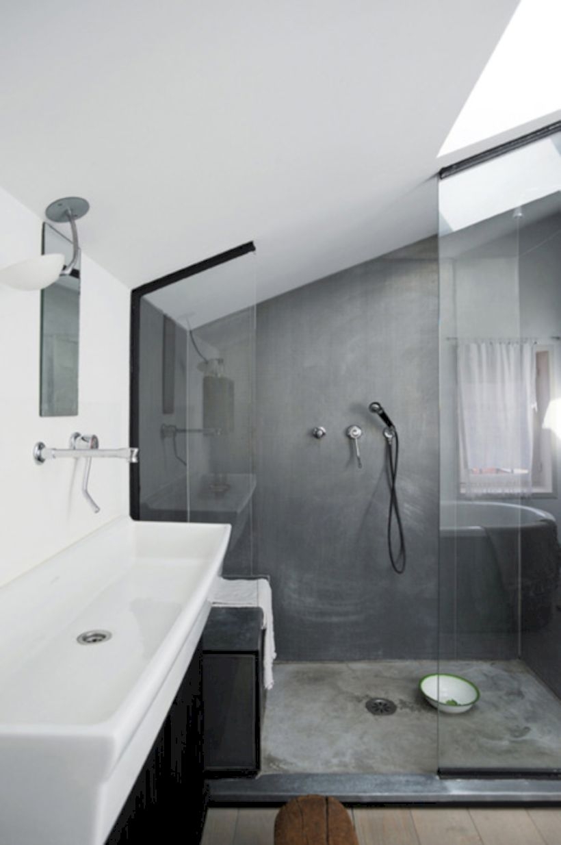 Nice and minimalist bathroom with the glass wall with a concrete 37