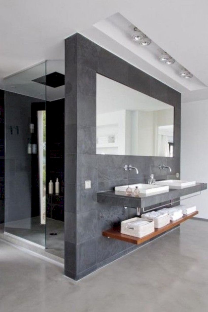 Nice and minimalist bathroom with the glass wall with a concrete 38