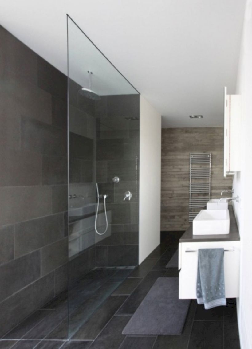 Nice and minimalist bathroom with the glass wall with a concrete 41