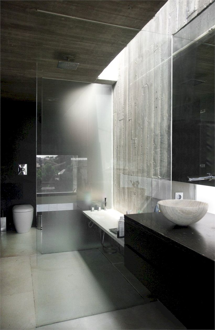 Nice and minimalist bathroom with the glass wall with a concrete 43