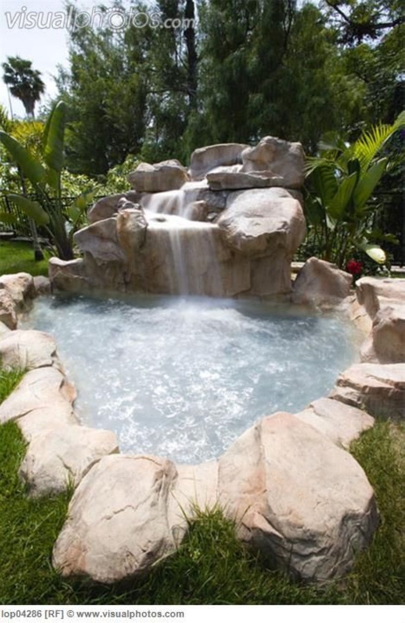 Pool waterfalls ideas for your outdoor space 06