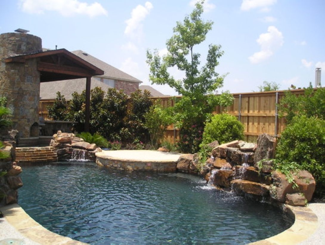Pool waterfalls ideas for your outdoor space 11