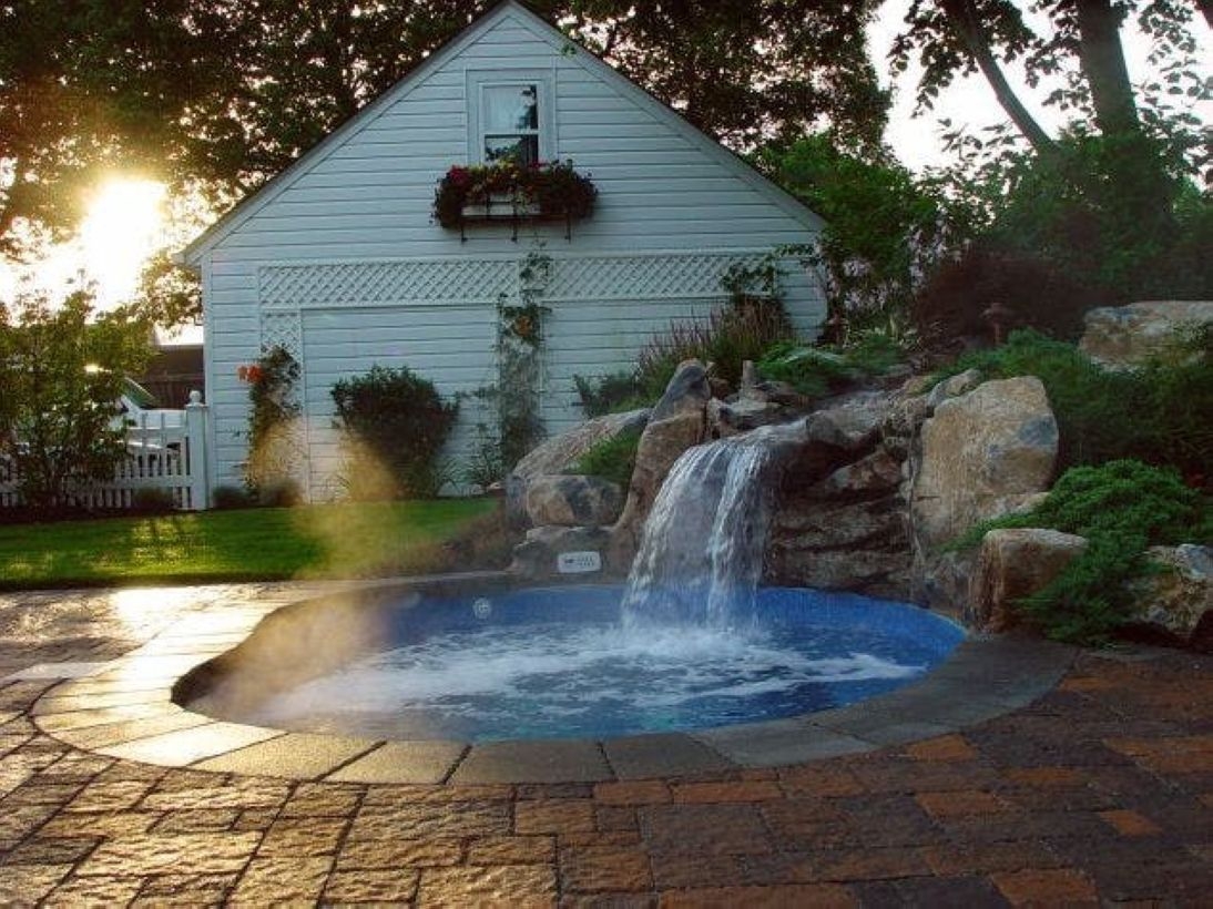 Pool waterfalls ideas for your outdoor space 13
