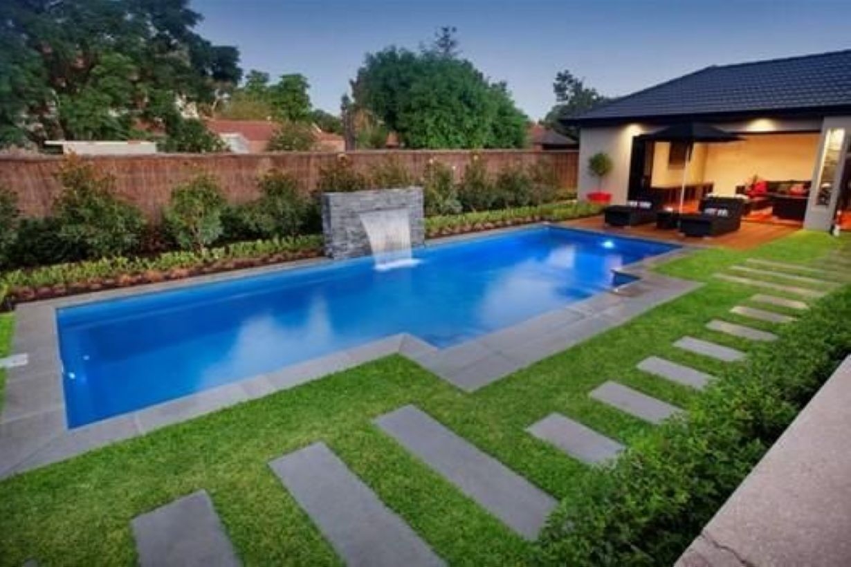 Pool waterfalls ideas for your outdoor space 15