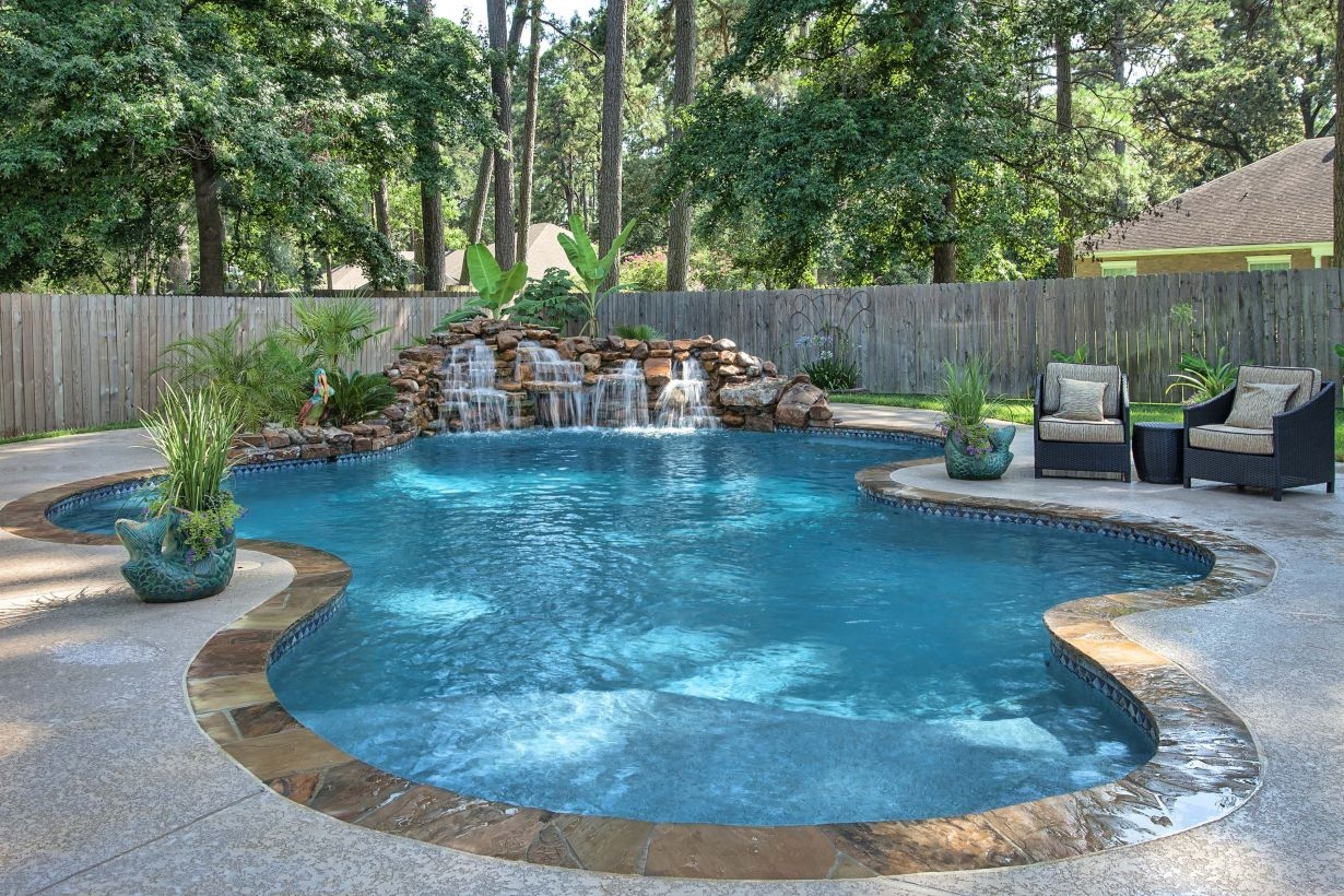 Pool waterfalls ideas for your outdoor space 17