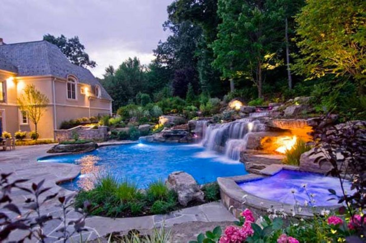Pool waterfalls ideas for your outdoor space 18