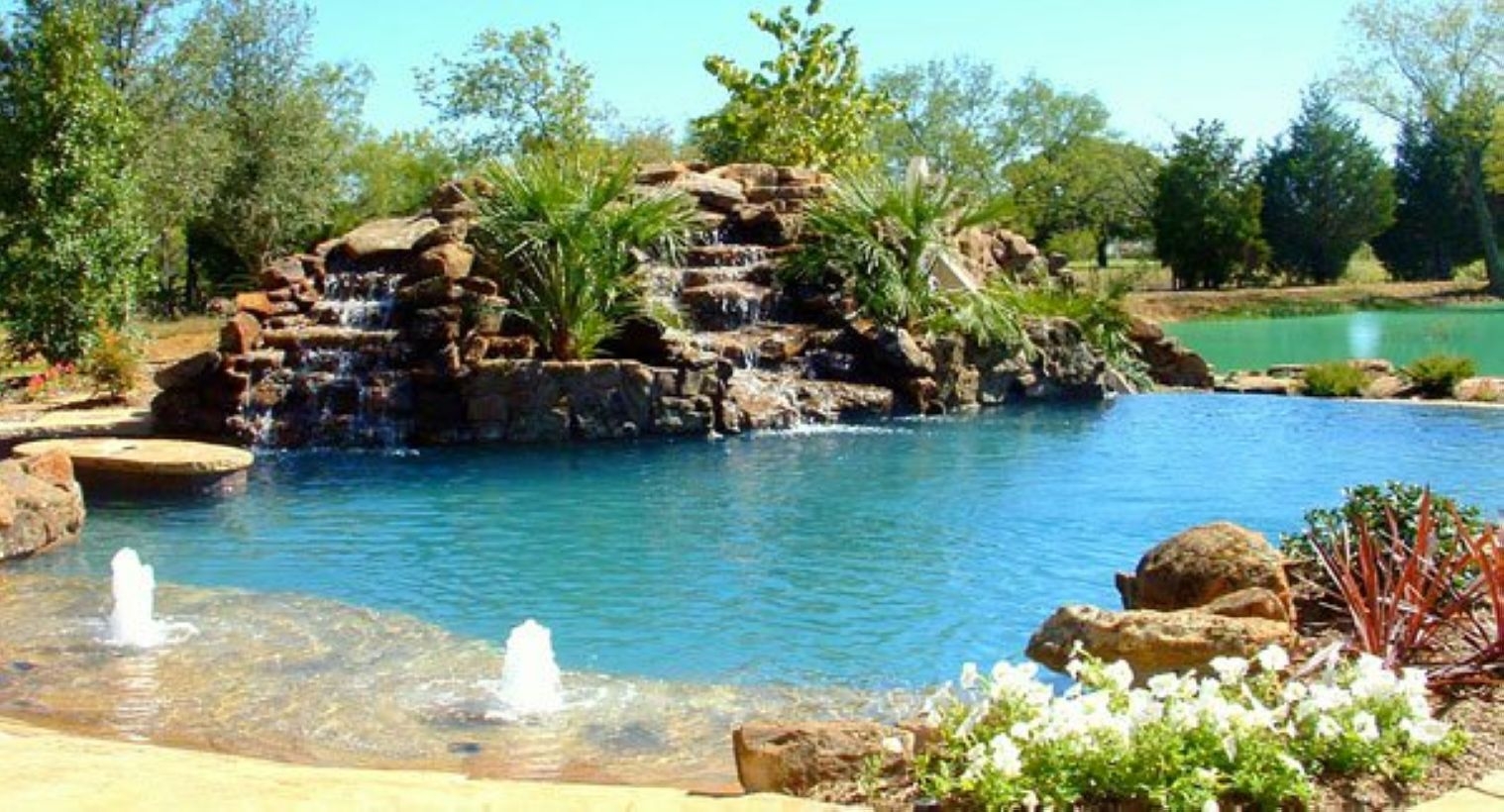 Pool waterfalls ideas for your outdoor space 19