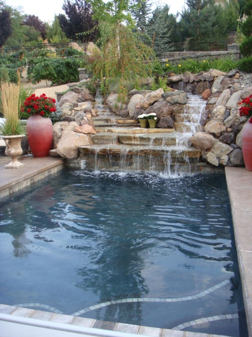 Pool waterfalls ideas for your outdoor space 20