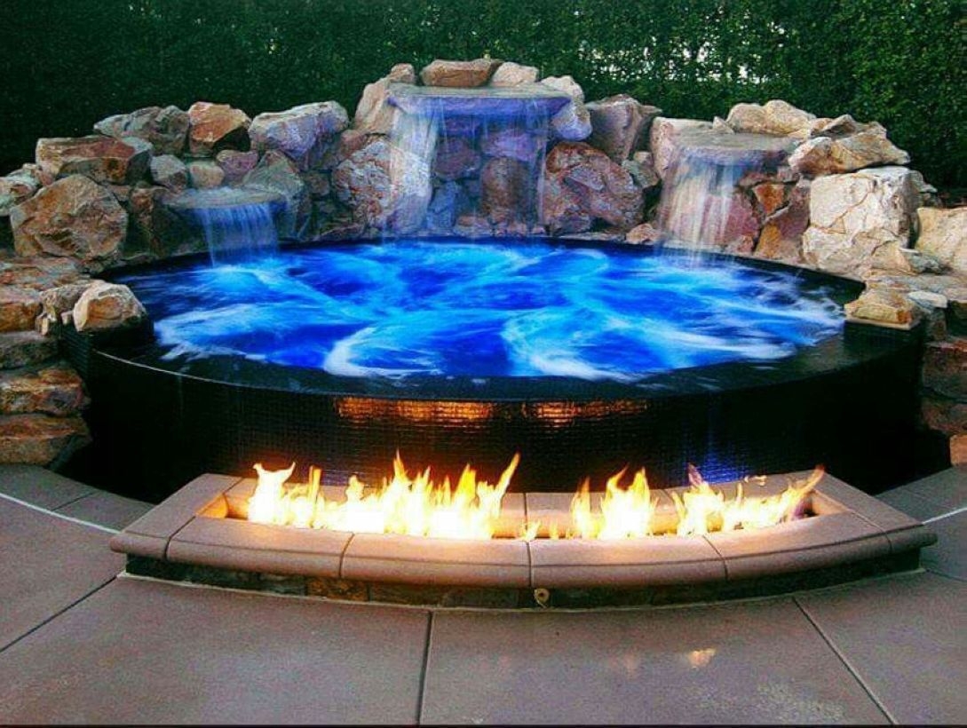 Pool waterfalls ideas for your outdoor space 23