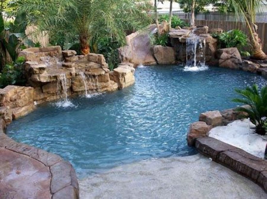 Pool waterfalls ideas for your outdoor space 24
