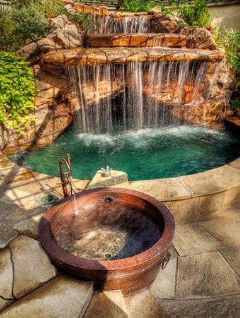 Pool waterfalls ideas for your outdoor space 25