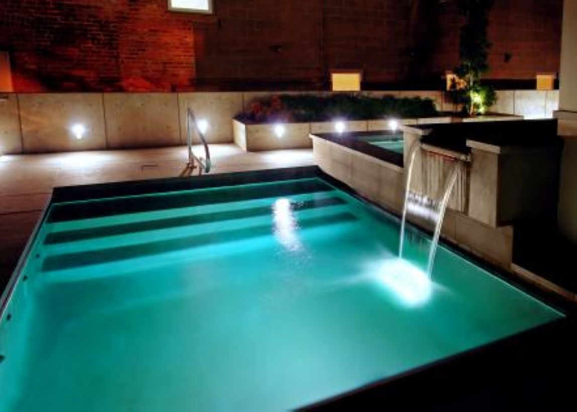Pool waterfalls ideas for your outdoor space 28