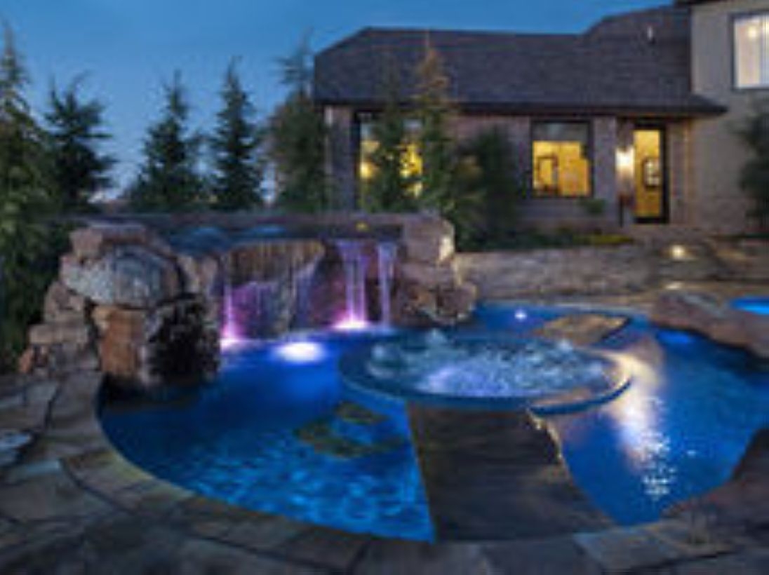 Pool waterfalls ideas for your outdoor space 29