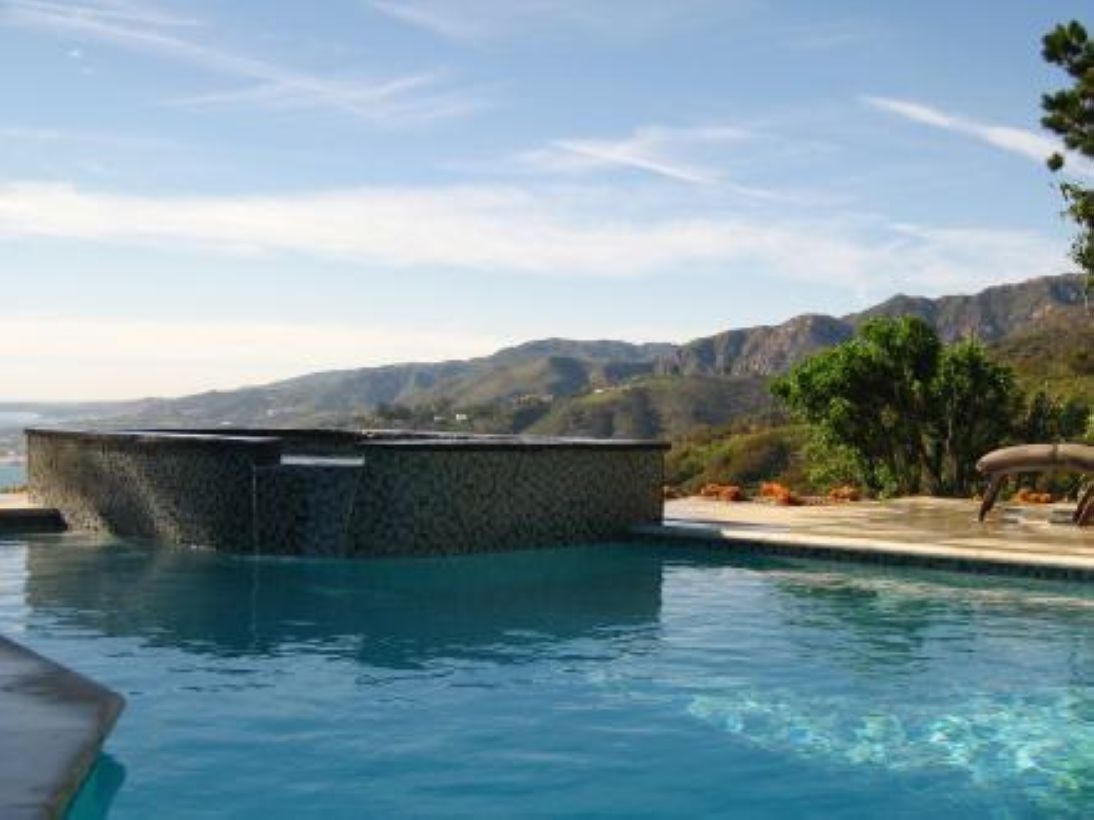 Pool waterfalls ideas for your outdoor space 30