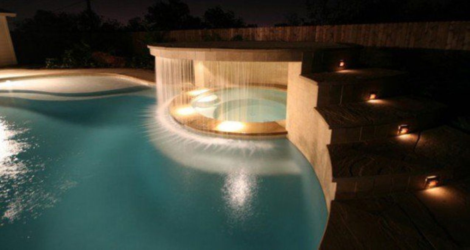 Pool waterfalls ideas for your outdoor space 31