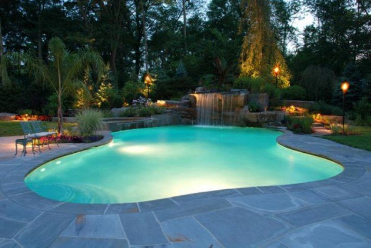 Pool waterfalls ideas for your outdoor space 32