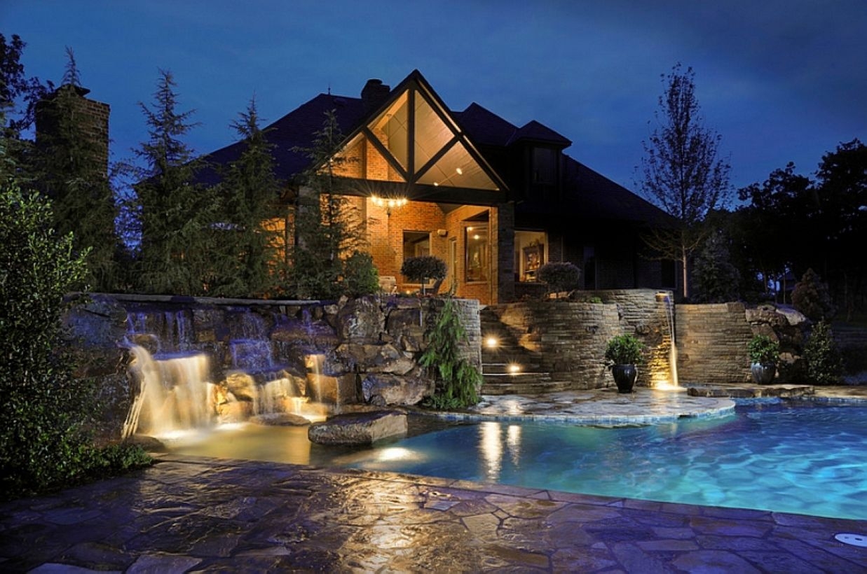 Pool waterfalls ideas for your outdoor space 39