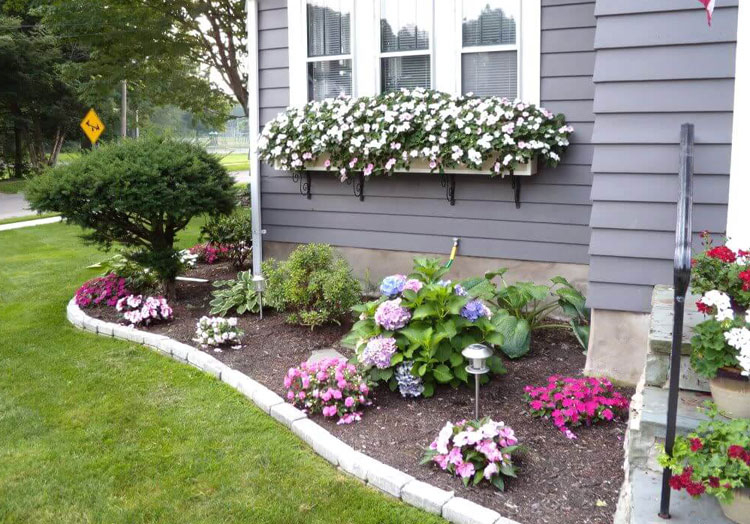 Pretty-floral-border-with-window-boxes-makes-for-a-nice-front-yard-landscaping-garden-idea