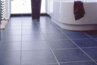 Bathroom with navy floor tiles