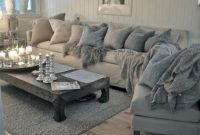Neutral sectional sofa and rustic wood coffee table in the living room