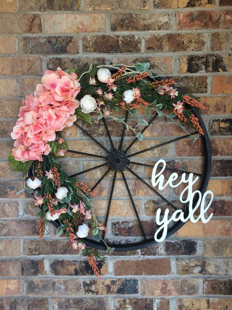 8. bicycle wheel wreath on the door