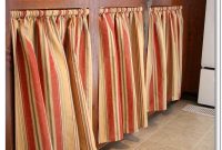 Recessed cabinet curtains in warm neutral stripes