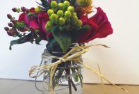 Mason jar arrangement with raffia bow