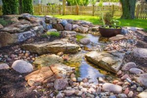 Design a fish pond garden with a waterfall concept 09