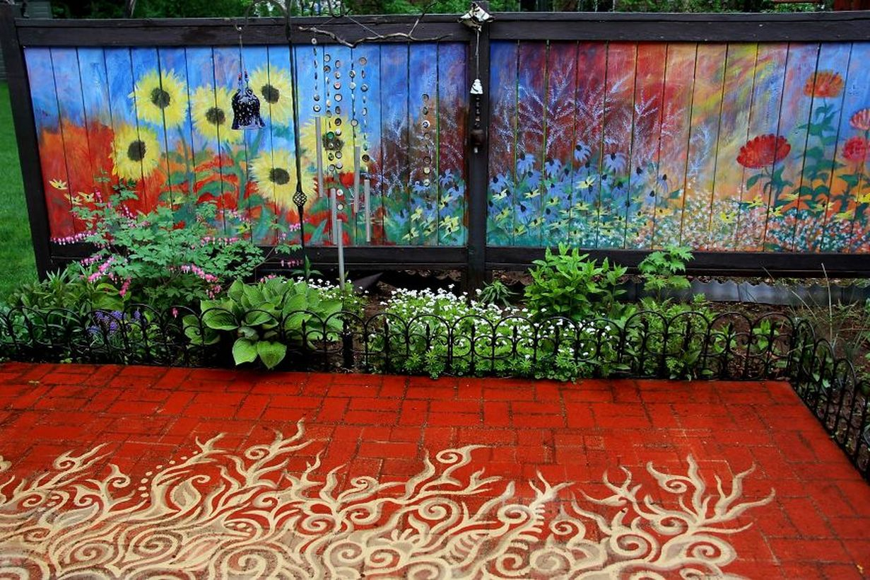 A beautiful painting fence for a garden with a full garden fence painted as a background in summer and also to add color to the landscape during the tedious winter months.