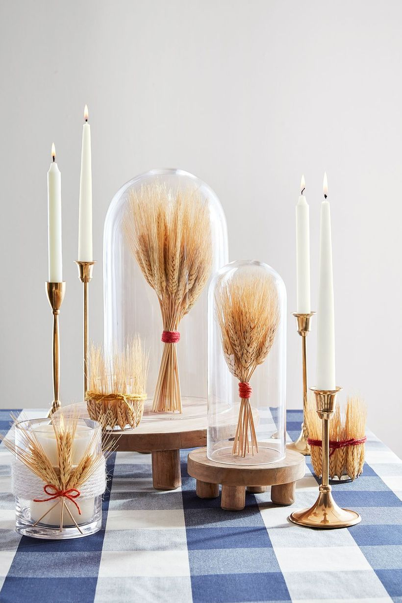 A perfect indoor redecoration from summer to fall with wheat use 'em to fill cloches and then arrange them on your dining table or entryway you need to try.