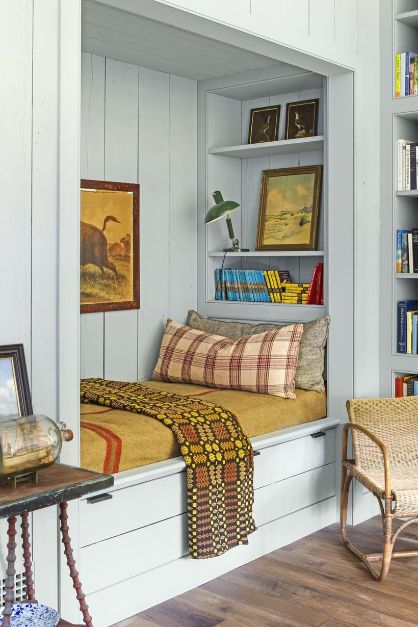 A wonderful indoor redecoration from summer to fall with plaids and stripes, this reading nook's subtle pops of cinnamon this to be the most popular indoor hangout spot of the season.