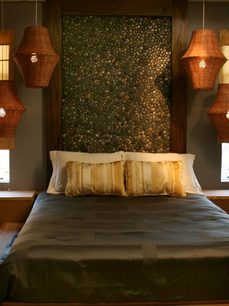An amazing bedroom with stone headboard to bringing natural elements into your bedroom