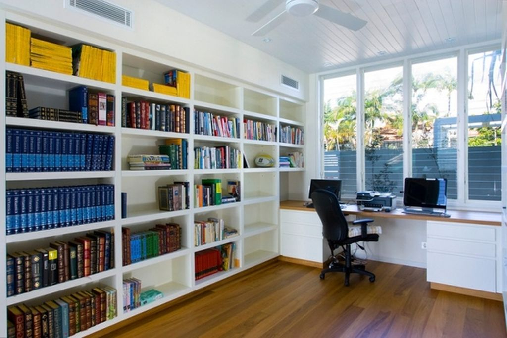 An amazing bookshelves in the side corner of the wall which are very large and accommodate several books to complete your home office