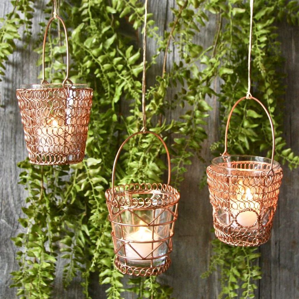 An amazing natural for home decor with hanging copper tea light holders to perfect your home