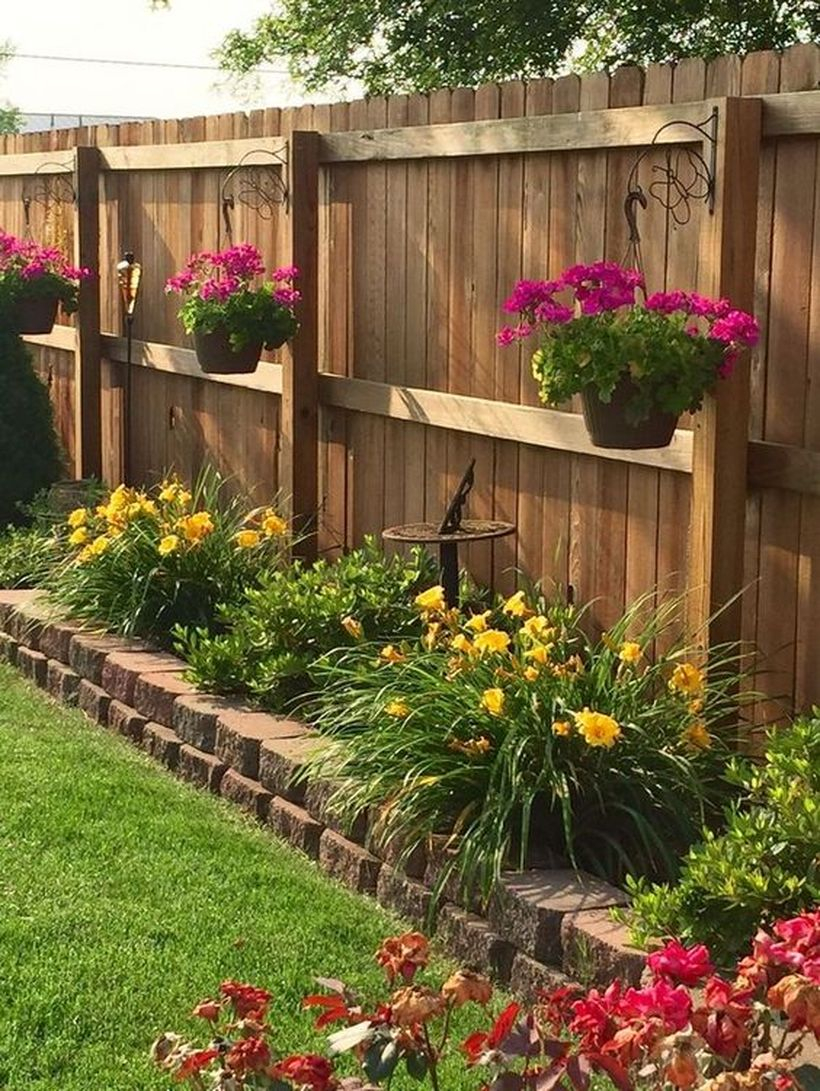 An attractive plant decoration for fence with hanging basket fence hanging baskets are relatively cheap and you can use them to really give your fence some life.