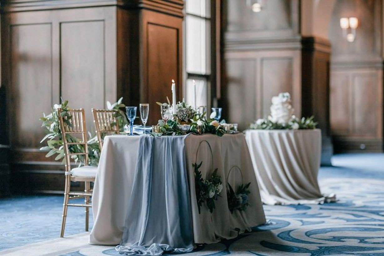 An awesome indoor table set for wedding with table runners, fairy lights are the perfect decoration for more rustic affairs and candles work well for vintage affairs.