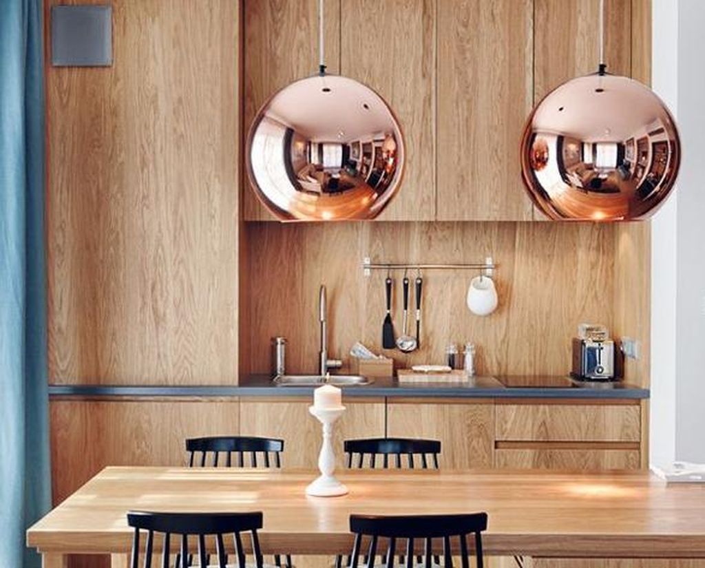 An awesome interior design trends for home with round copper hanging lamps above table to perfect your dining room