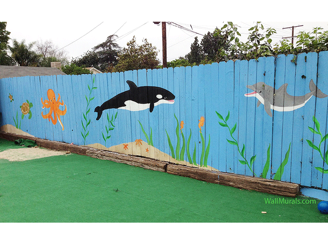 An exciting painting fence for garden with painting of sea animals that would brighten anyones day and make for a great playscape full of imagination.