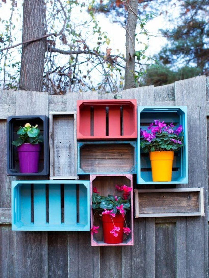 An exciting plant decoration for fence with rustic wooden crate shelves add beauty to your backyard and have all that storage space tools or plants.