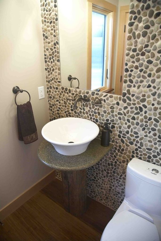 Beautiful bathroom design with river rock wall to bringing natural elements into your home